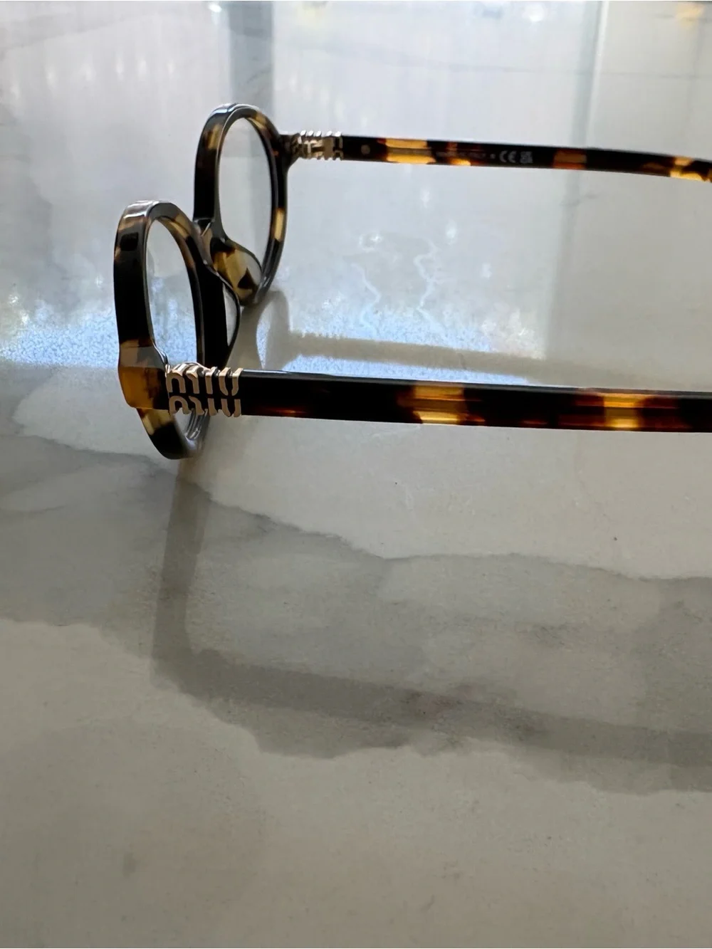 Miu Miu Tortoiseshell Oval Glasses - Brown and Amber
